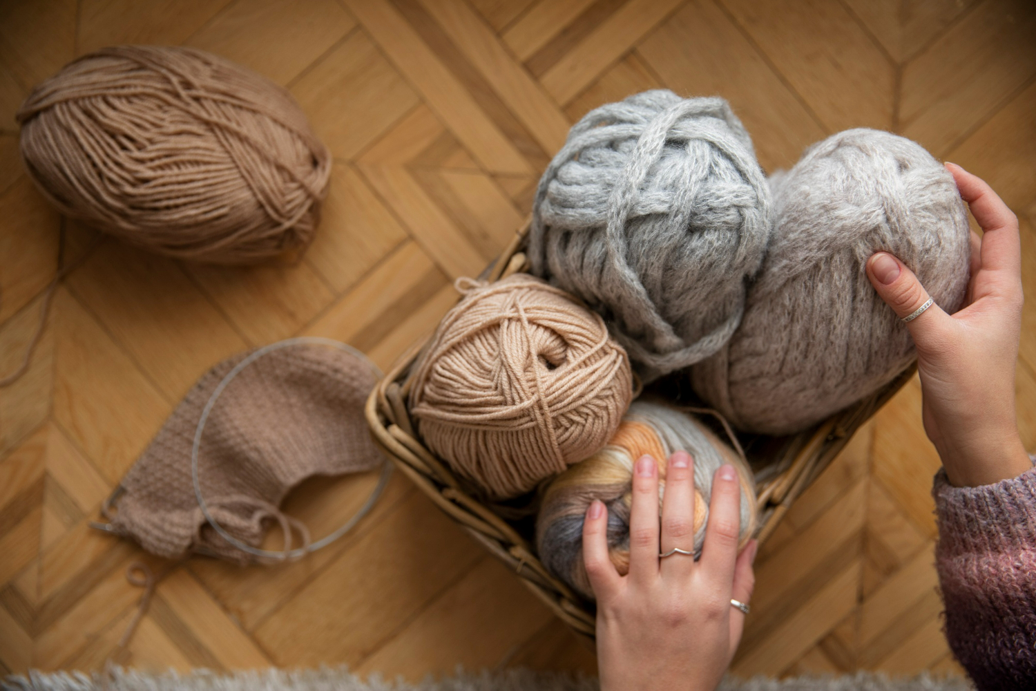 close-up-hands-holding-knitting-yarns